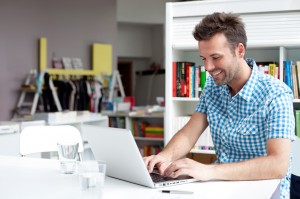 Student working on laptop in library